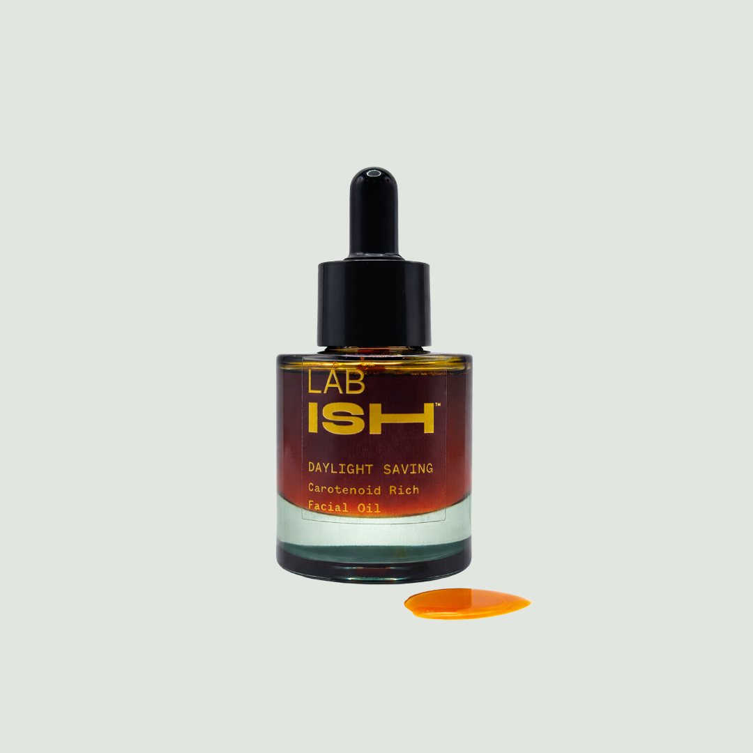 Facial oil dropper bottle with 'Lab Ish' branding on a light gray background, Daylight Saving facial oil